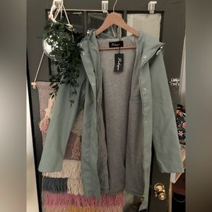 Heavy duty long rain coat, women’s size medium. Sage green